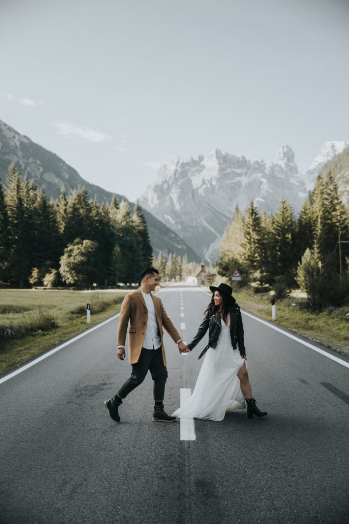 Dolomites wedding photographer, couple crossing street